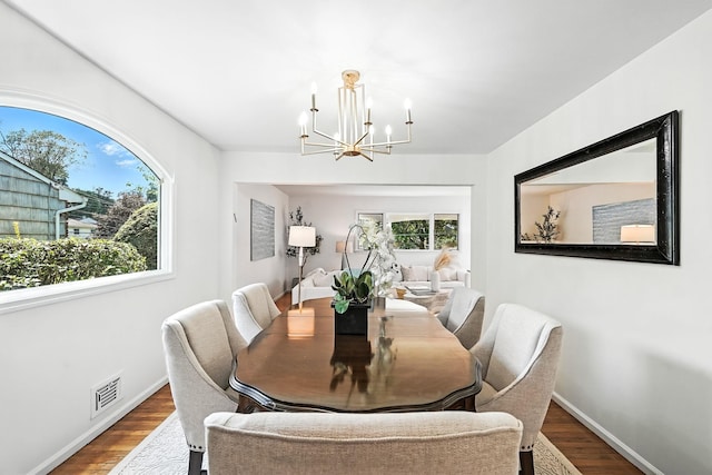65 Shepherds Dr, Scarsdale, NY 10583 - dining area with a chandelier, plenty of natural light, and wood finished floors