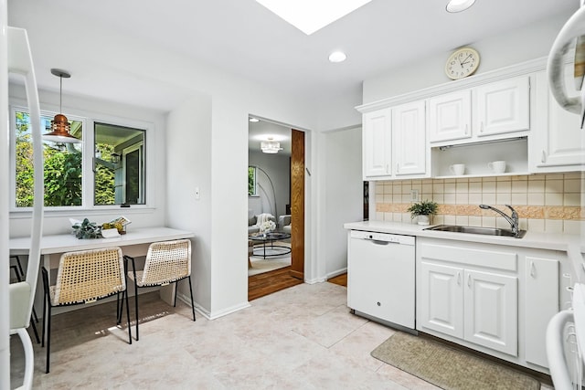 65 Shepherds Dr, Scarsdale, NY 10583 - kitchen featuring white dishwasher, decorative backsplash, light countertops, open shelves, and white cabinetry