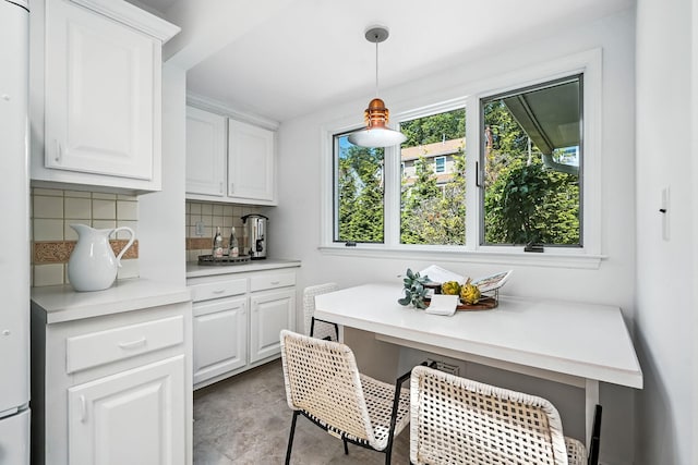 65 Shepherds Dr, Scarsdale, NY 10583 - kitchen featuring light countertops, tasteful backsplash, white cabinets, and decorative light fixtures