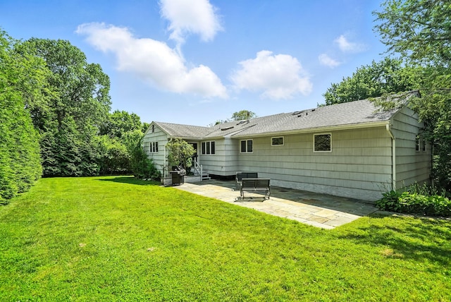 65 Shepherds Dr, Scarsdale, NY 10583 - rear view of house featuring a patio area and a lawn