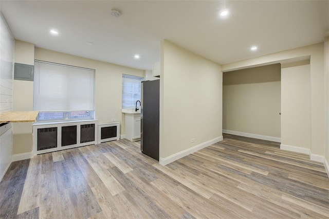 71--36 110th St Unit 1/L, Forest Hills, NY 11375 - unfurnished living room with light wood finished floors and recessed lighting