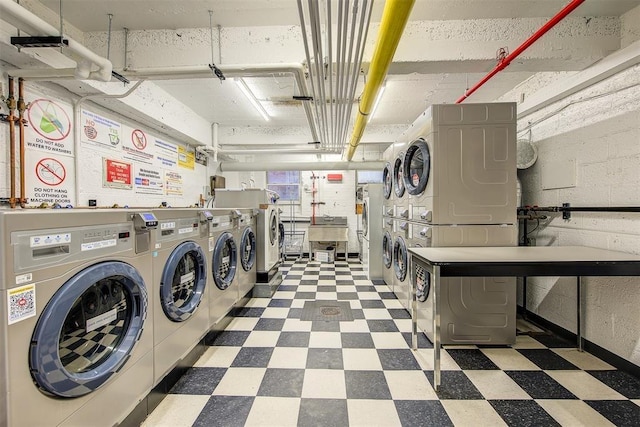 71--36 110th St Unit 1/L, Forest Hills, NY 11375 - shared laundry with estacked washer and dryer, tile patterned floors, washer and dryer, and a garage