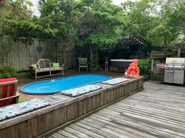 457 Fire Island Blvd, Fire Island Pines, NY 11782 - view of pool featuring a jacuzzi, a deck, grilling area, and a fenced backyard