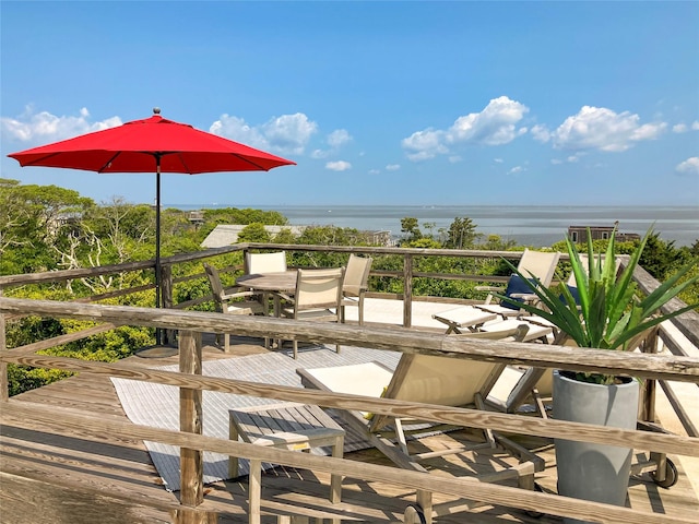 457 Fire Island Blvd, Fire Island Pines, NY 11782 - wooden terrace featuring outdoor dining area and a water view