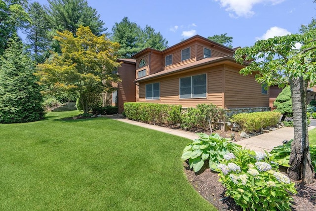 43 Hunt Dr, Jericho, NY 11753 - view of front facade featuring a front lawn