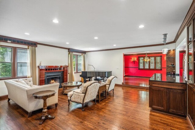 43 Hunt Dr, Jericho, NY 11753 - living area with ornamental molding, dark wood-style floors, a lit fireplace, and recessed lighting
