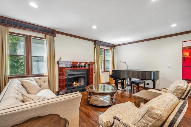 43 Hunt Dr, Jericho, NY 11753 - living room featuring recessed lighting, crown molding, a warm lit fireplace, dark wood-style floors, and healthy amount of natural light