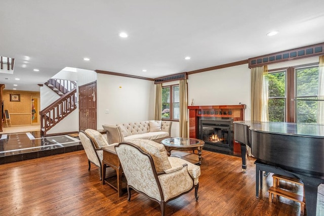 43 Hunt Dr, Jericho, NY 11753 - living area with ornamental molding, stairway, a glass covered fireplace, wood finished floors, and recessed lighting