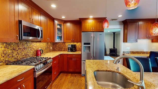 25 Mckinley St, Pearl River, NY 10965 - kitchen featuring stainless steel appliances, decorative light fixtures, light stone countertops, glass insert cabinets, and recessed lighting