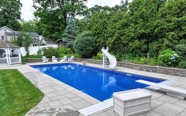 25 Mckinley St, Pearl River, NY 10965 - view of swimming pool with a water slide, a patio, a gazebo, and a diving board