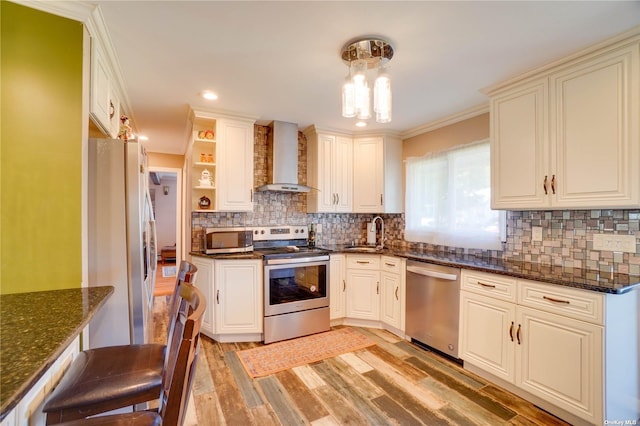 20 Basket Ln, Hicksville, NY 11801 - kitchen featuring stainless steel appliances, wall chimney exhaust hood, light wood-style floors, backsplash, and dark stone counters
