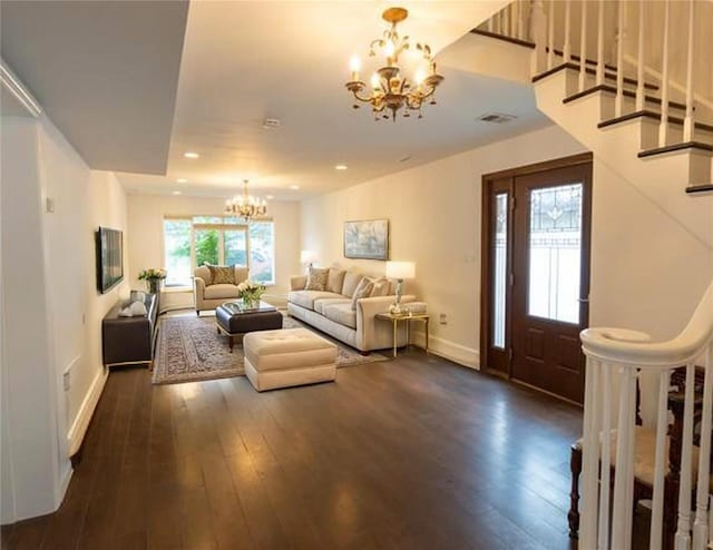 16107 90th St, Howard Beach, NY 11414 - living room featuring a chandelier, dark wood-style floors, stairs, and recessed lighting