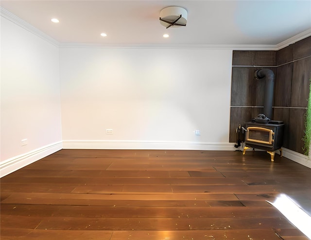 16107 90th St, Howard Beach, NY 11414 - empty room featuring a wood stove, crown molding, wood-type flooring, and recessed lighting