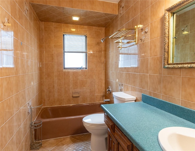 16107 90th St, Howard Beach, NY 11414 - bathroom featuring vanity, tile walls, tile patterned floors, and  shower combination