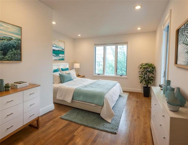 16107 90th St, Howard Beach, NY 11414 - bedroom with wood finished floors and recessed lighting