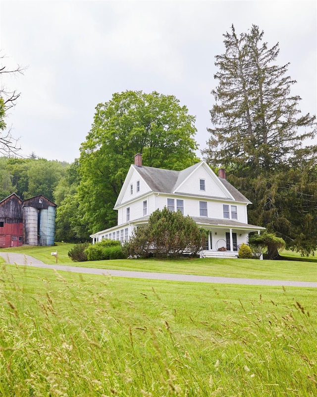 54 Davis Ln, Grahamsville, NY 12740 - view of front of property featuring a chimney, a front yard, and an outdoor structure