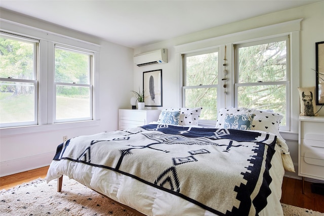 54 Davis Ln, Grahamsville, NY 12740 - bedroom featuring a wall mounted air conditioner and wood finished floors