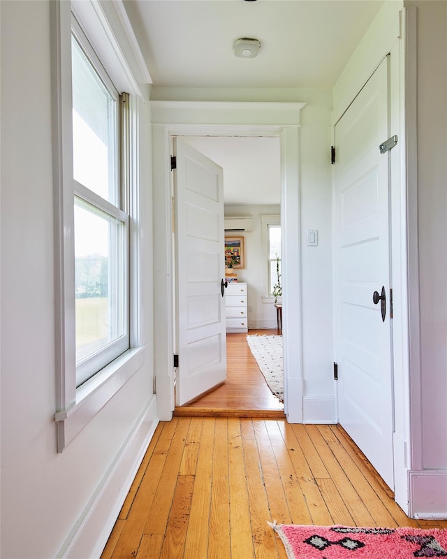 54 Davis Ln, Grahamsville, NY 12740 - hall featuring a wall unit AC, light wood finished floors, and healthy amount of natural light