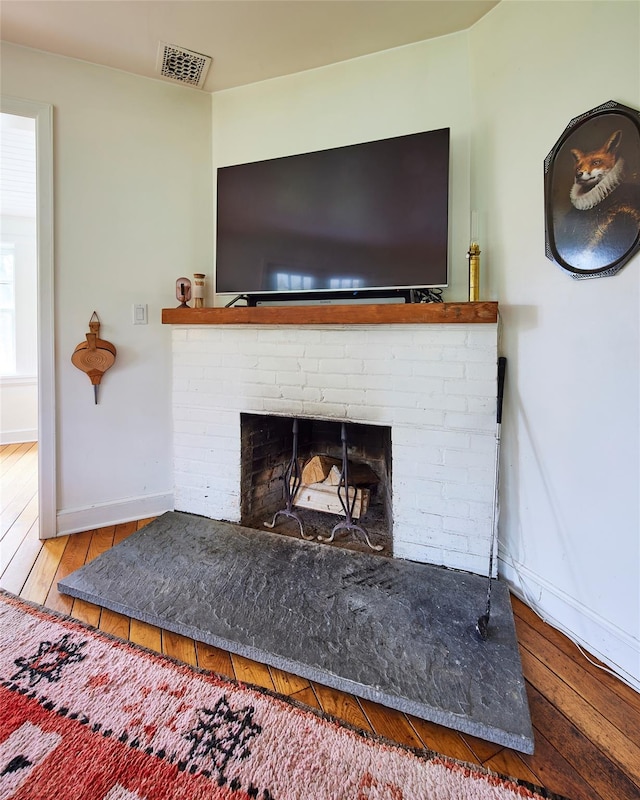 54 Davis Ln, Grahamsville, NY 12740 - detailed view of a brick fireplace and wood finished floors
