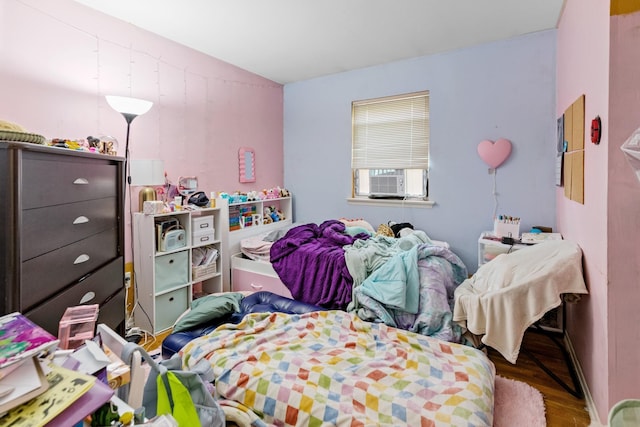 18 Happy Acres Dr, Shirley, NY 11967 - bedroom featuring wood finished floors and cooling unit