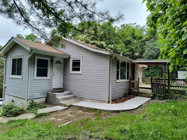 1 Whippoorwill Trl, Monroe, NY 10950 - bungalow featuring a wooden deck, a chimney, and a front lawn