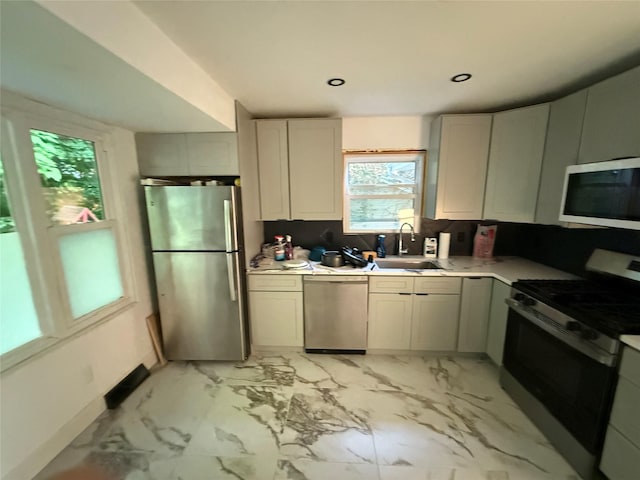 1 Whippoorwill Trl, Monroe, NY 10950 - kitchen featuring stainless steel appliances, light countertops, light marble finish floors, and recessed lighting