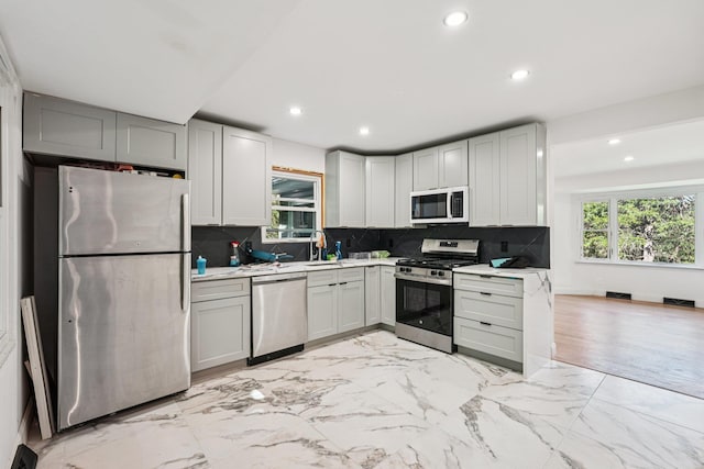 1 Whippoorwill Trl, Monroe, NY 10950 - kitchen featuring stainless steel appliances, light countertops, recessed lighting, backsplash, and light marble finish flooring