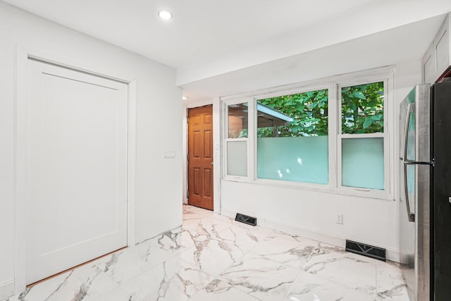 1 Whippoorwill Trl, Monroe, NY 10950 - unfurnished bedroom with freestanding refrigerator, recessed lighting, and light marble finish flooring
