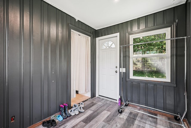 1 Whippoorwill Trl, Monroe, NY 10950 - foyer with healthy amount of natural light, wood finished floors, wooden walls, and crown molding