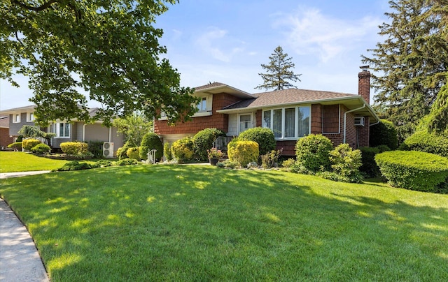 15 Lane Ave, Plainview, NY 11803 - split level home featuring a chimney, a front lawn, and a shingled roof