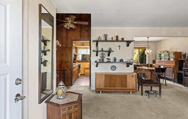 15 Lane Ave, Plainview, NY 11803 - kitchen with light carpet, ceiling fan, a chandelier, open shelves, and decorative light fixtures