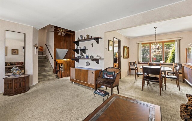 15 Lane Ave, Plainview, NY 11803 - carpeted living area featuring a ceiling fan, stairway, and a chandelier