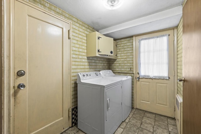 15 Lane Ave, Plainview, NY 11803 - washroom featuring cabinet space, washer and dryer, wallpapered walls, and stone finish floors