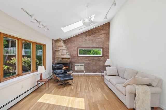 19 Evelyn Rd, Plainview, NY 11803 - living room featuring rail lighting, a skylight, baseboard heating, healthy amount of natural light, and vaulted ceiling