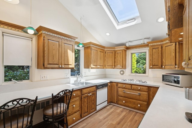 19 Evelyn Rd, Plainview, NY 11803 - kitchen with white appliances, a skylight, light countertops, vaulted ceiling, and light wood-type flooring