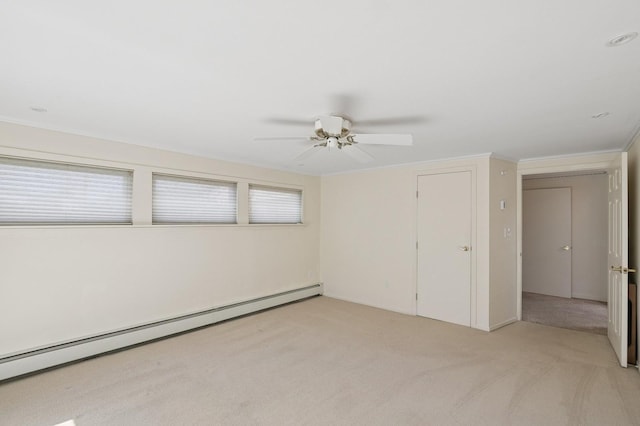 19 Evelyn Rd, Plainview, NY 11803 - unfurnished room featuring a baseboard heating unit, light colored carpet, and ceiling fan