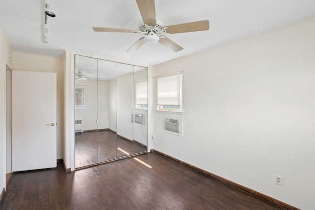 19 Evelyn Rd, Plainview, NY 11803 - unfurnished bedroom with radiator heating unit, wood finished floors, a wall mounted AC, a closet, and ceiling fan