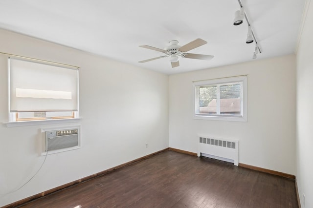 19 Evelyn Rd, Plainview, NY 11803 - unfurnished room featuring radiator, track lighting, dark wood-type flooring, a wall mounted AC, and a ceiling fan