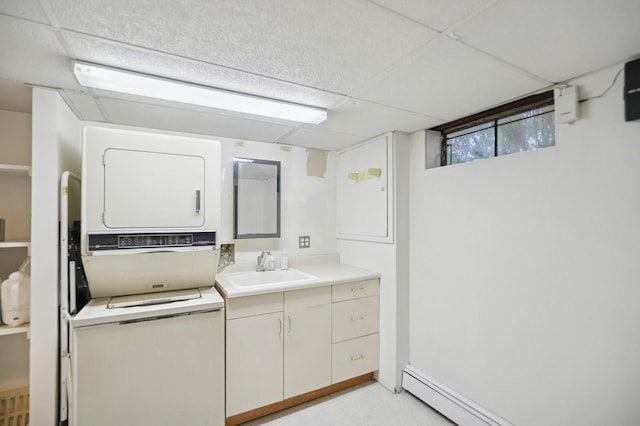 19 Evelyn Rd, Plainview, NY 11803 - bathroom featuring stacked washer / drying machine, vanity, tile patterned floors, and a baseboard radiator