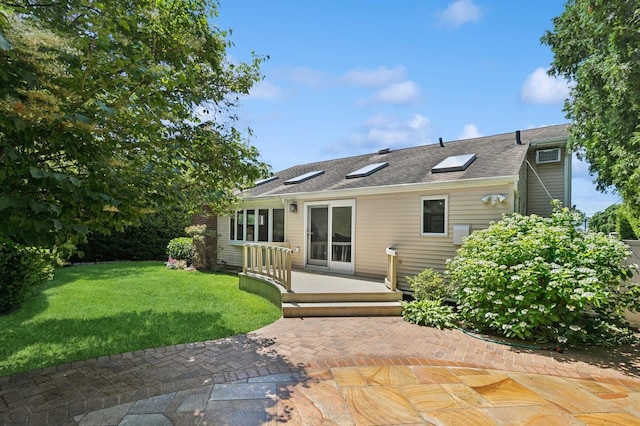 19 Evelyn Rd, Plainview, NY 11803 - rear view of property featuring a yard, a patio, a wooden deck, and roof with shingles