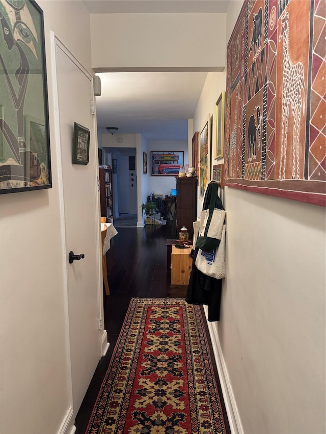 33-27 91st St Unit 5F, Jackson Heights, NY 11372 - hallway with dark wood-style floors and baseboards