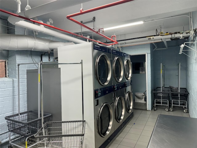 33-27 91st St Unit 5F, Jackson Heights, NY 11372 - communal laundry room featuring estacked washer and dryer, independent washer and dryer, and tile patterned flooring