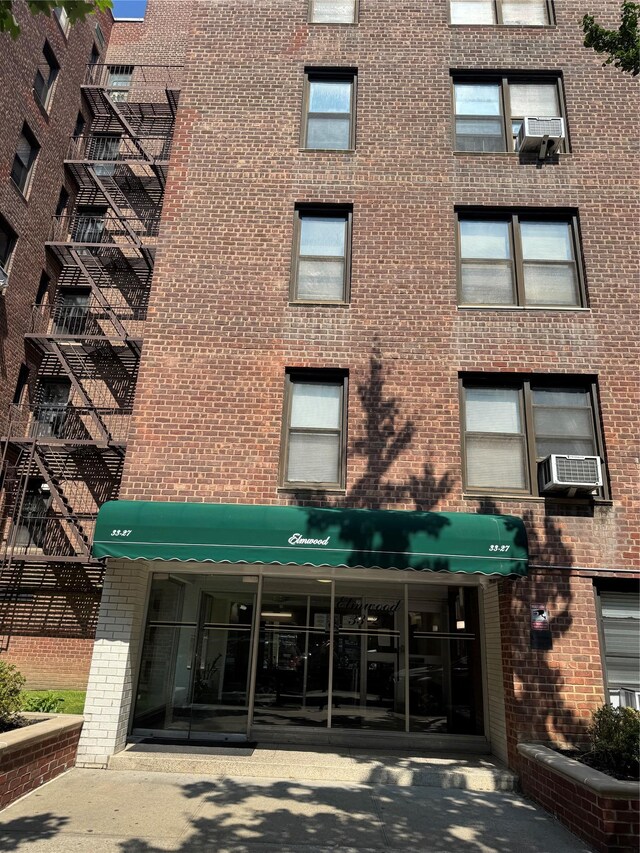 33-27 91st St Unit 5F, Jackson Heights, NY 11372 - view of apartment building / complex featuring cooling unit