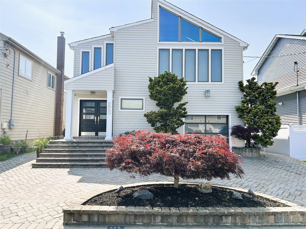 220 Lee Pl, Bellmore, NY 11710 - view of front of property with french doors