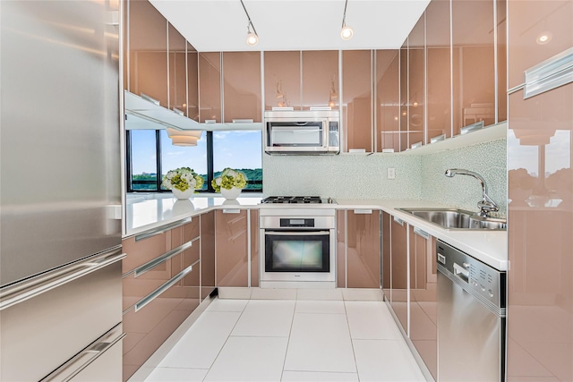 2287 Johnson Ave Unit 17J, Bronx, NY 10463 - kitchen with appliances with stainless steel finishes, light countertops, modern cabinets, backsplash, and track lighting