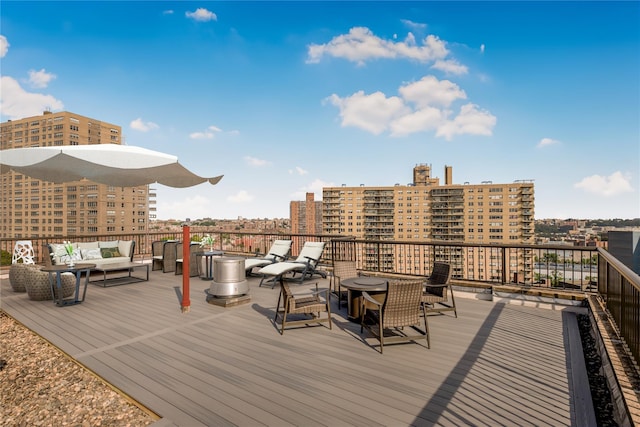 2287 Johnson Ave Unit 17J, Bronx, NY 10463 - wooden deck featuring an outdoor hangout area and a view of city