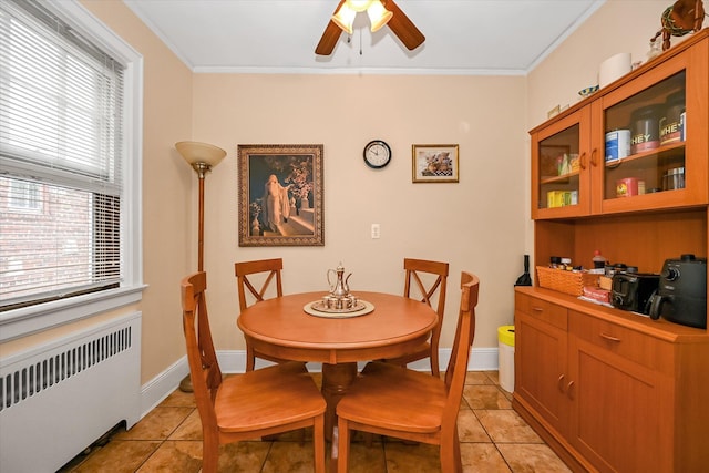 32-15 149th St, Flushing, NY 11354 - dining room featuring radiator, ceiling fan, crown molding, light tile patterned flooring, and healthy amount of natural light