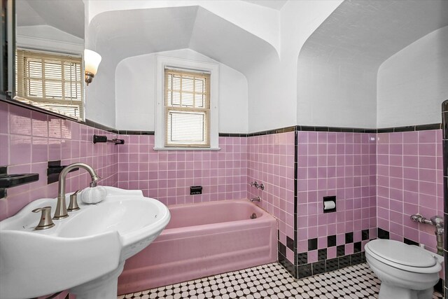 32-15 149th St, Flushing, NY 11354 - full bath with tile walls, a garden tub, wainscoting, and tile patterned floors