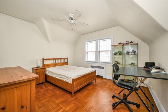 32-15 149th St, Flushing, NY 11354 - bedroom with radiator heating unit, vaulted ceiling, a desk, and ceiling fan