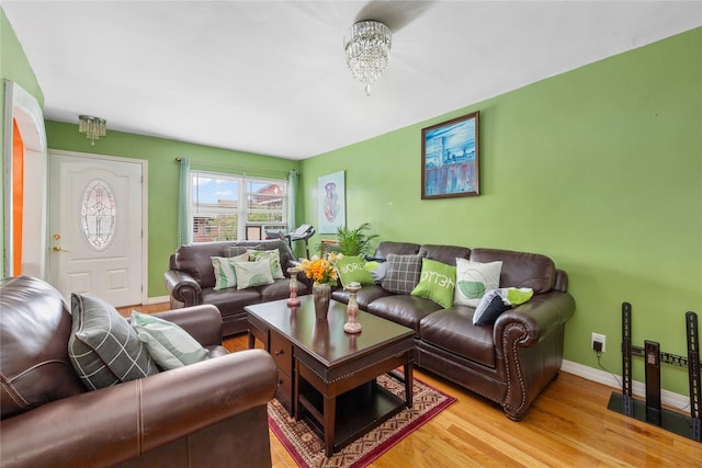 1157 E 102nd St, Brooklyn, NY 11236 - living room with light wood finished floors and a chandelier